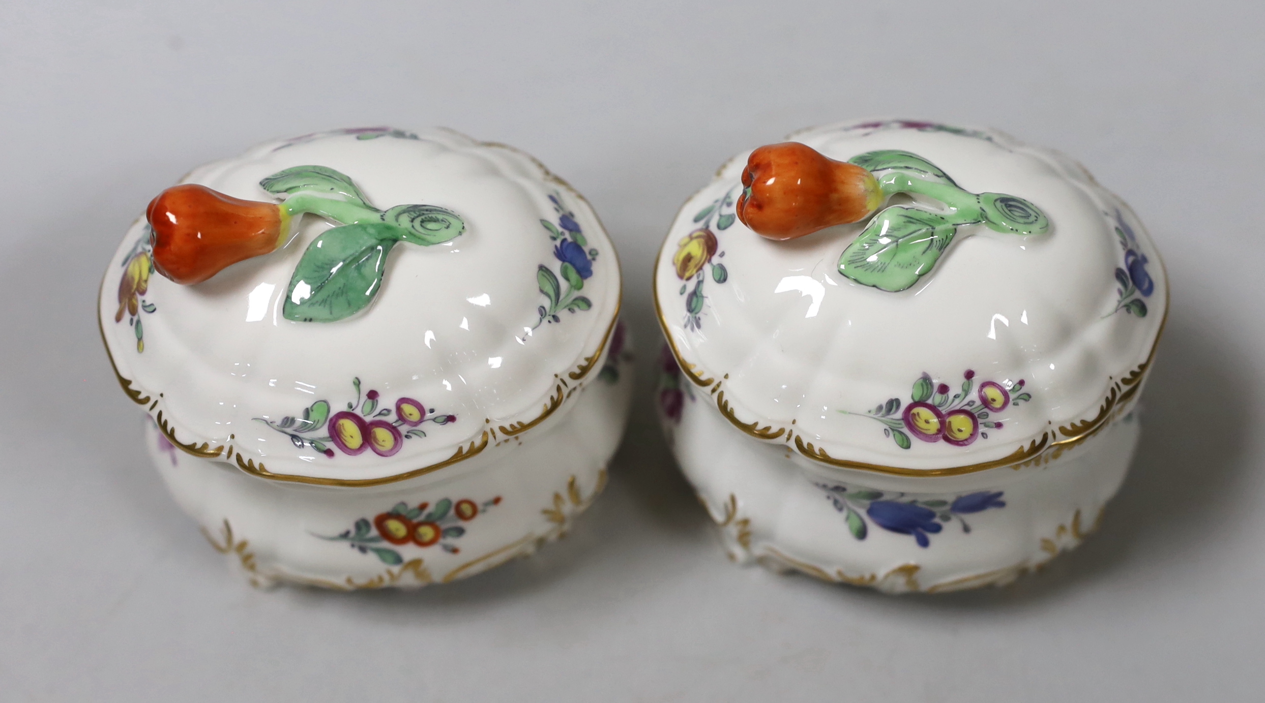 Two Nymphenburg salts pots and covers, 9cm tall